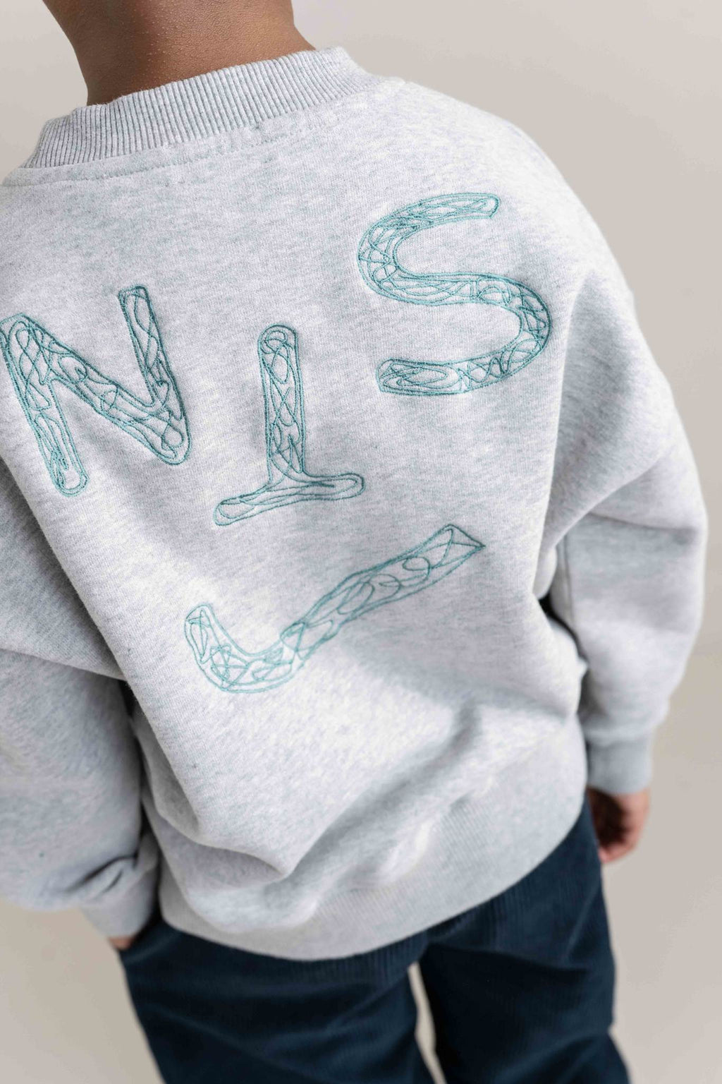 JNST SWEATER